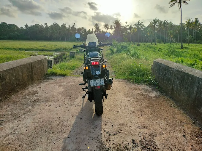 Rural village road with motorcycle